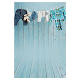 Hanging Clothes Before Blue Wood Wall Backdrop for Photography